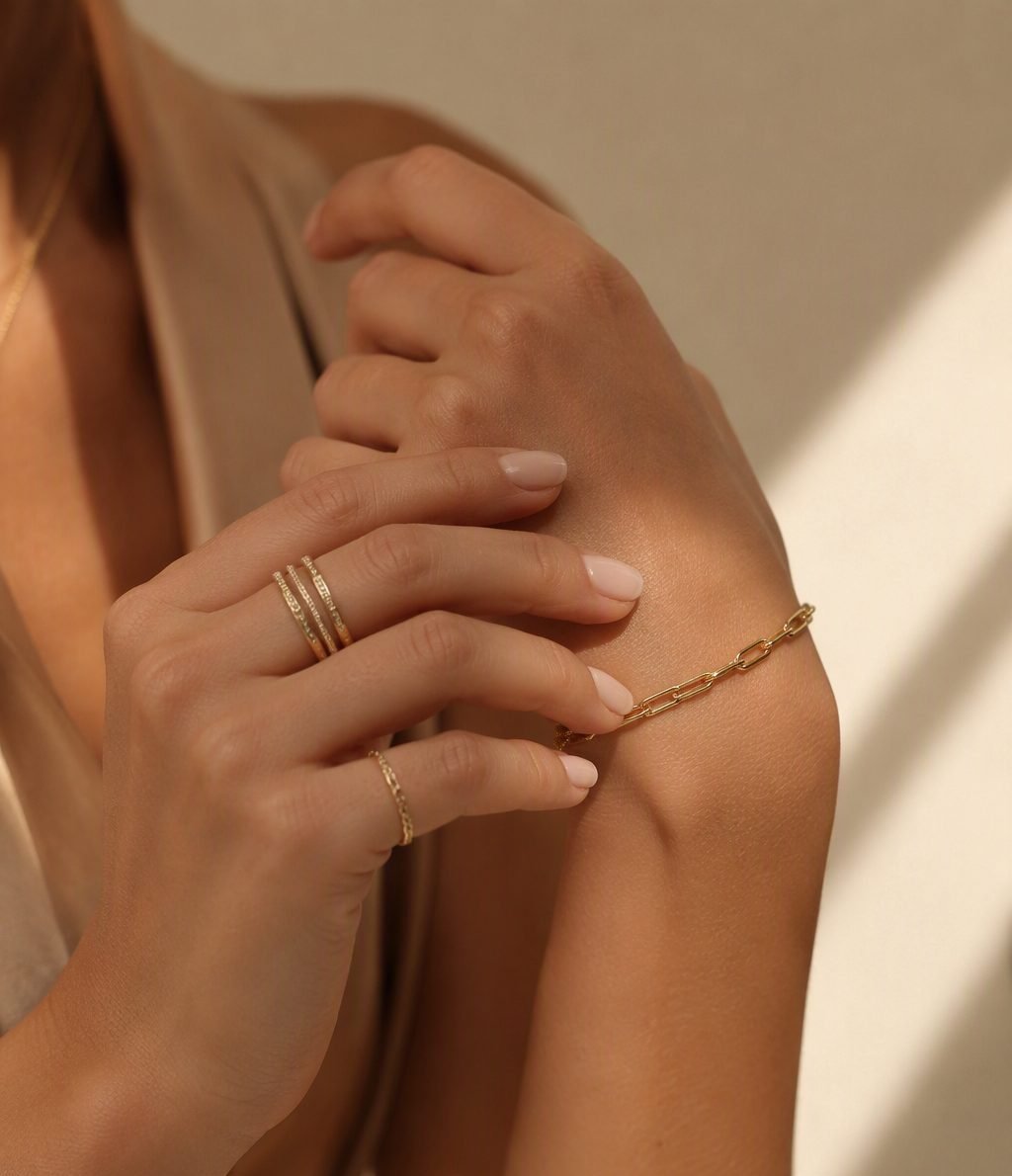 Hands wearing stacked gold rings